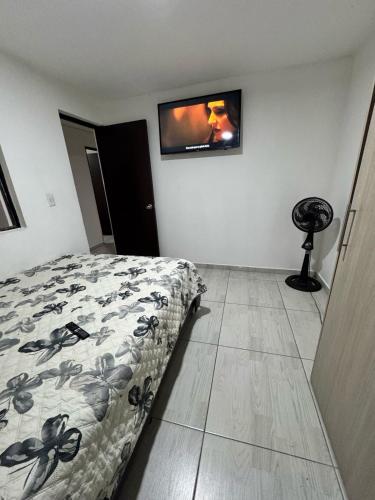 Ένα ή περισσότερα κρεβάτια σε δωμάτιο στο Hermoso apartamento completamente dotado