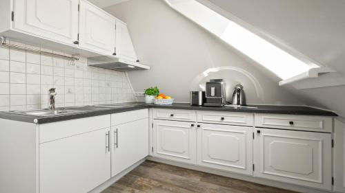 Dapur atau dapur kecil di Gurtdeel Leuchtturm-Suite