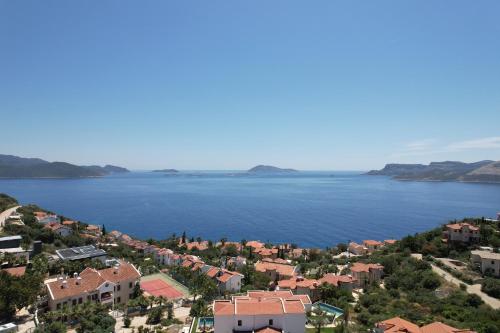 an aerial view of a town next to a large body of water at Sea Garden Kaş Hotel in Kas