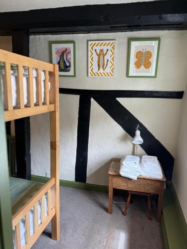 a doll house with a bunk bed and a table at Bel and The Dragon-Odiham in Odiham