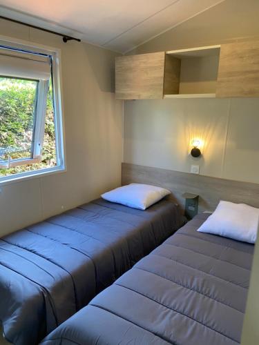 Giường trong phòng chung tại Bungalow Toscane 3 chambres