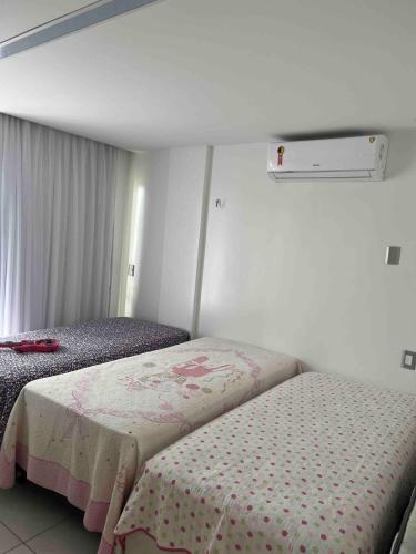 a bedroom with two beds in a room at Complete beach house! in Cabedelo