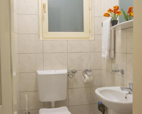 a bathroom with a toilet and a sink at Montesan Luxury Apartment Beach Front in Sveti Stefan