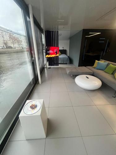 a living room with a view of the water at Dom na wodzie in Bydgoszcz