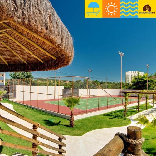 a tennis court with a tennis court at Suites Le Jardin Caldas Novas - Temporada in Caldas Novas