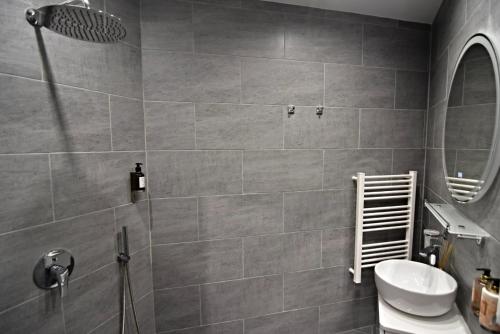 a bathroom with a shower and a toilet and a sink at Oblivion in Velingrad