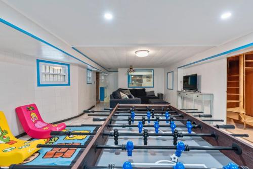 a room with a bunch of trampolines at Oversized Family Beach Block Duplex with Game Room in Atlantic City