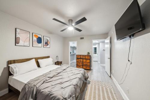 a bedroom with a bed and a ceiling fan at The Chandler 412 I Spacious 1 Bed 1 Bath in Grand Prairie
