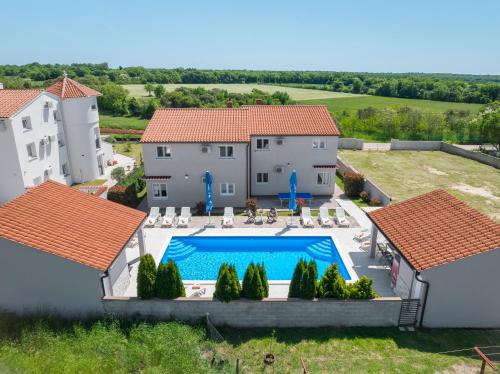 an aerial view of a house with a swimming pool at Villa Brcina in Pula