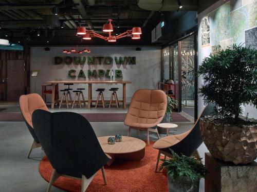 a room with chairs and a table and a counter at Downtown Camper by Scandic in Stockholm