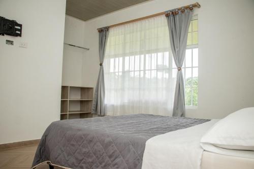 Postel nebo postele na pokoji v ubytování Villa Alfonso