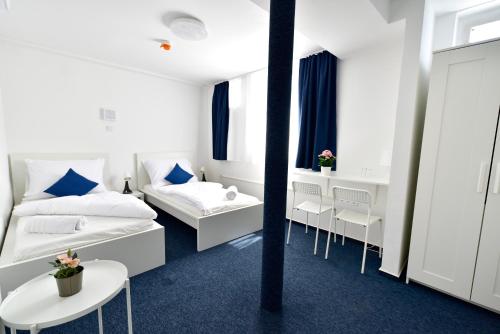 Postel nebo postele na pokoji v ubytování Zama Hotel