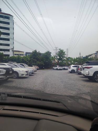 a bunch of cars parked in a parking lot at mstay in Bangkok