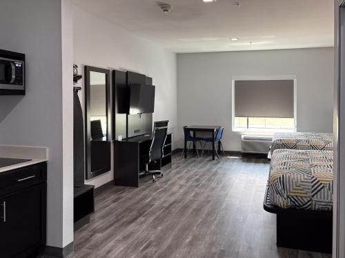 Ένα ή περισσότερα κρεβάτια σε δωμάτιο στο Studio 6 Dallas, TX – Fair Park