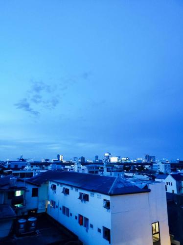 a view of a city at night at mstay in Bangkok