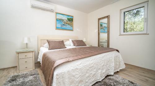 Postel nebo postele na pokoji v ubytování Villa Rustica Dalmatia