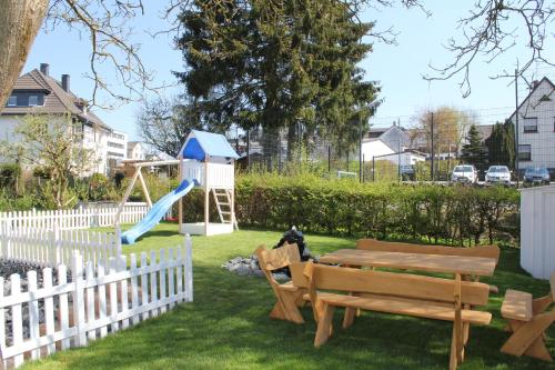 a playground with a table and a slide at City Ferienhaus Vulkaneifel in Daun