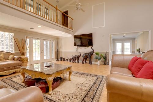 a living room with a couch and a table at Sauna and Pool Access Luxe Wellington Apt! in Wellington