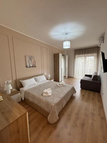 a large bedroom with a bed and a couch at Inn Rhome 71 in Rome