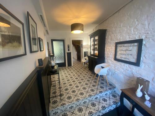 a hallway with a staircase with a tile floor at La Villa Garenne in Vannes