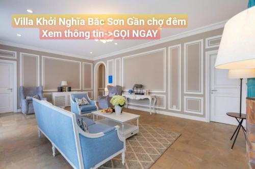 a living room with blue chairs and a table at Chillin Villa - Biệt Thự Đà Lạt Khu Nhiều Thông Gần Hồ Tuyền Lâm in Xuan An