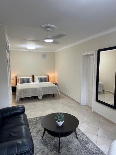 a living room with a bed and a couch at Villa Victoria With Heated Pool in Callao Salvaje