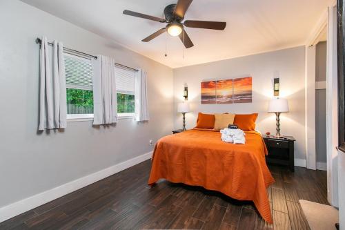 a bedroom with a bed and a ceiling fan at The Oasis with New Salt Pool Close to Everything in Gainesville