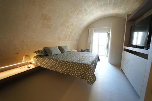 Postel nebo postele na pokoji v ubytování La Scordata Luxury Apartment & Private Spa