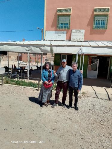 a group of people standing in front of a building at Rani hani chez ali in Tinerhir