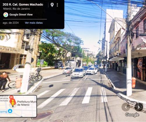 a rendering of a city street with cars on the road at Hostel vila nova in Niterói