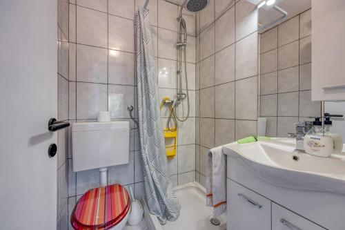 a bathroom with a shower and a sink at Mikelic Stara Barbariga in Barbariga
