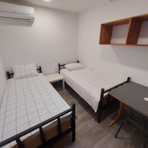 Postel nebo postele na pokoji v ubytování Rookos rooms