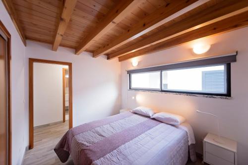 Ένα ή περισσότερα κρεβάτια σε δωμάτιο στο Casa da Amparo