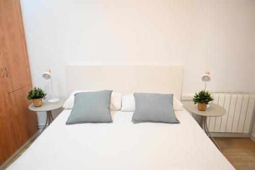 Ένα ή περισσότερα κρεβάτια σε δωμάτιο στο Homenfun Barcelona Avenida Diagonal