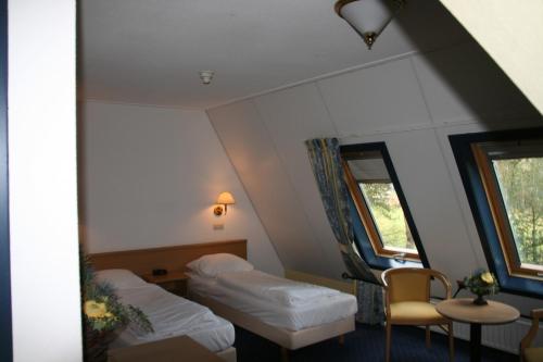 Ένα ή περισσότερα κρεβάτια σε δωμάτιο στο Hotel Hardenberg