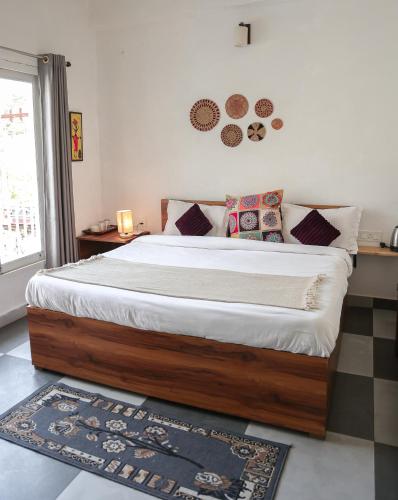 a bedroom with a large bed in a room at Hidden Lake By Vista Stays in Bhīm Tāl