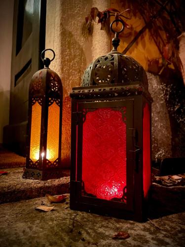 two lanterns sitting on the floor in a room at Villa Oleandro in Casima