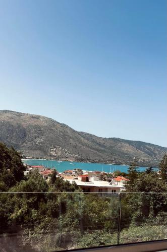 a view of a body of water with a mountain at ALTHEA luxury suites and apartments in Plataria