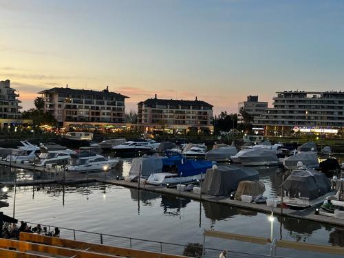 a group of boats docked in a marina with buildings at Estadía de Lujo con vista soñada a la Bahía grande de Nordelta in Benavídez