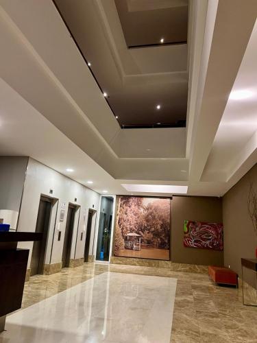 a lobby with a ceiling with a painting on it at Estadía de Lujo con vista soñada a la Bahía grande de Nordelta in Benavídez