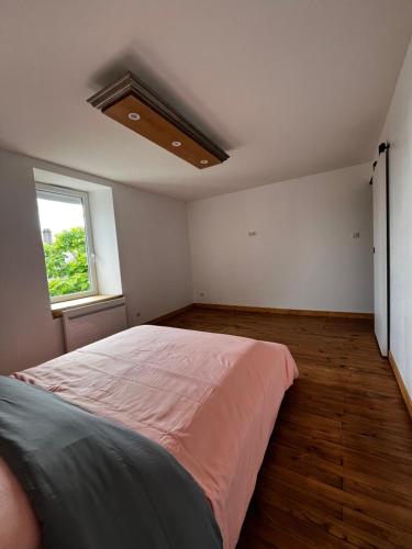Ein Bett oder Betten in einem Zimmer der Unterkunft Maison de l'olivier