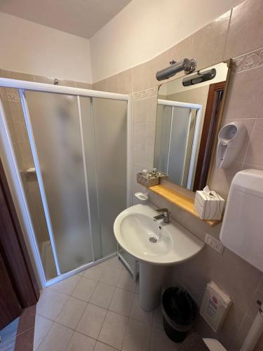 a bathroom with a shower and a sink at Hotel Garni Bel Sito in Tremosine Sul Garda