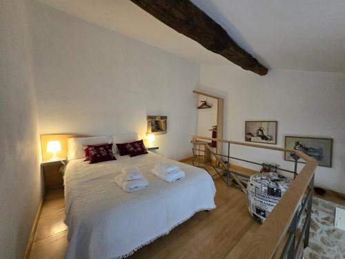 a bedroom with a bed with towels on it at Beautiful home in the countryside in Sernancelhe