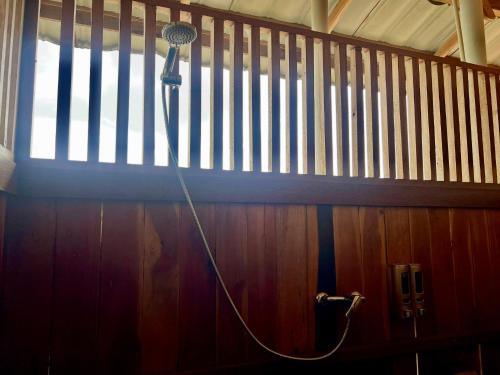 a hair dryer on the wall of a room at Pesona 361 Alam Bungalows in Rarang