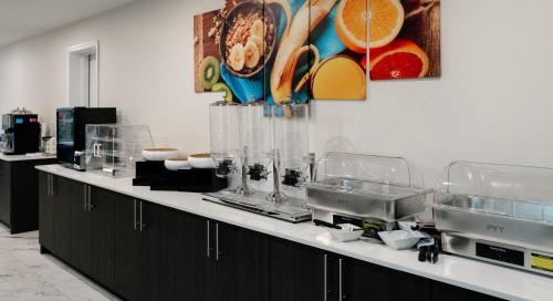 a kitchen with a counter with glasses and bowls at SerenityStay Chattanooga Hamilton Place in Chattanooga