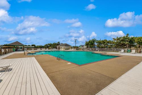 a swimming pool with blue water in a resort at Prickly Pear 723 in Avon