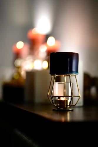 a light sitting on top of a table at Aparthotel Amella in Rīga
