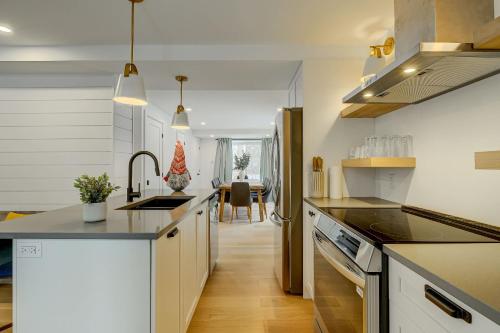 a kitchen with white cabinets and a counter top at 951 Shefford 4 bedrooms house in Bromont