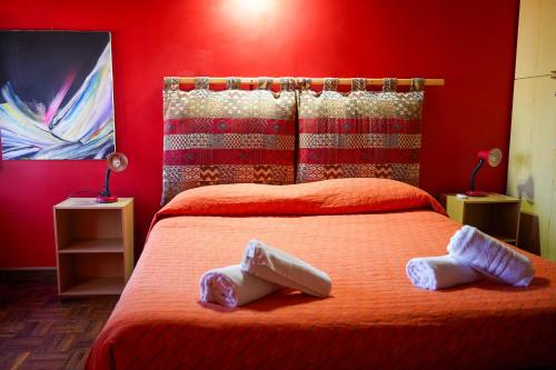 En eller flere senge i et værelse på Villa Batú