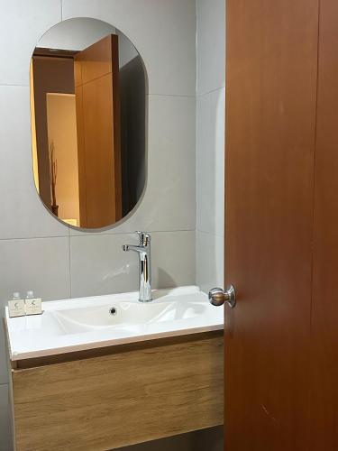 a bathroom with a sink and a mirror at Hotel Santa Clara Boutique in Montería